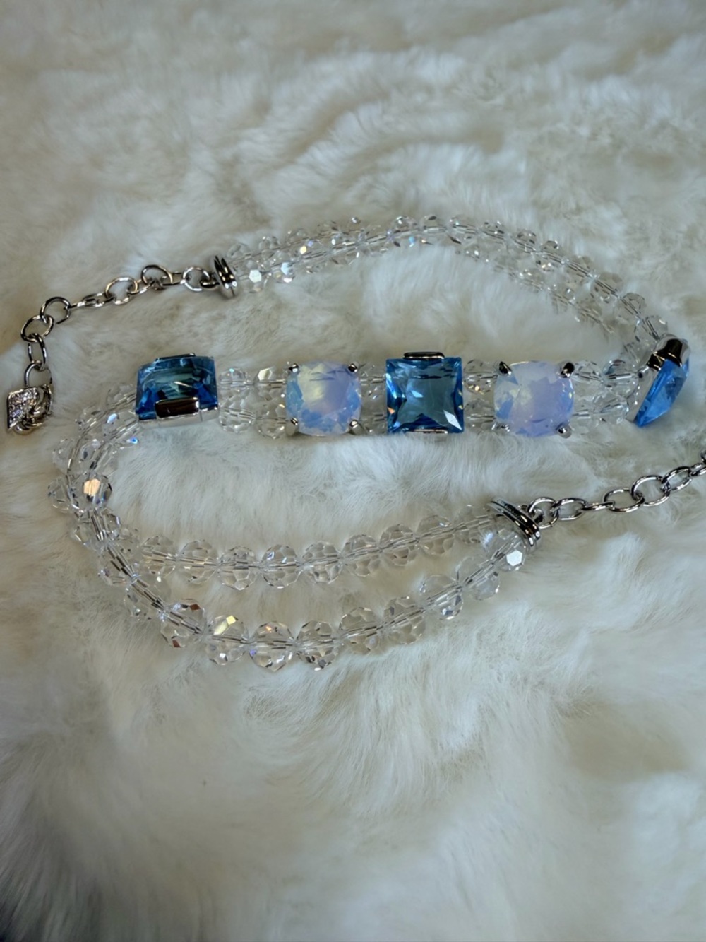 Genuine Swarovski Blue and Clear Crystal.
Made by Swarovski with Swan Clasp